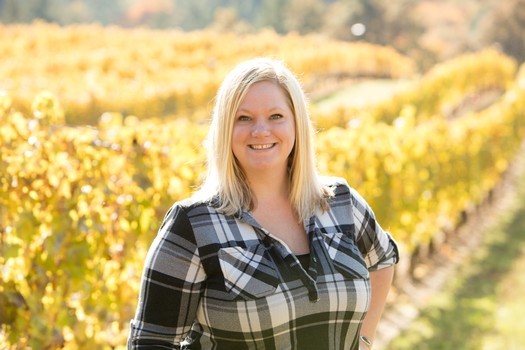 Becky Kramer, General Manager of Kramer Vineyards, smiling.